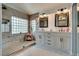 Elegant bathroom featuring double vanities, a glass shower, and modern fixtures at 8253 Ruby Mountain Way, Las Vegas, NV 89128