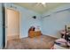 Bedroom featuring light blue walls, carpet flooring, shelves, and a ceiling fan at 8253 Ruby Mountain Way, Las Vegas, NV 89128