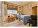 Cozy bedroom with tile flooring, nautical decorations, and comfortable furnishings at 8253 Ruby Mountain Way, Las Vegas, NV 89128
