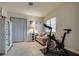 Inviting exercise room featuring a stationary bike and cozy seating area at 8253 Ruby Mountain Way, Las Vegas, NV 89128