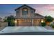 Charming two-story home with a three-car garage and well-manicured landscaping at 8253 Ruby Mountain Way, Las Vegas, NV 89128