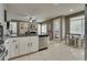 Kitchen view with an island, stainless steel appliances, modern lighting, and easy access to the living room at 8253 Ruby Mountain Way, Las Vegas, NV 89128