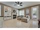 Comfortable living room features a fireplace, open shelving, and is conveniently next to the kitchen and breakfast nook at 8253 Ruby Mountain Way, Las Vegas, NV 89128