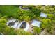 Aerial view of a modern playground and lush green park featuring picnic areas and walking trails at 8253 Ruby Mountain Way, Las Vegas, NV 89128