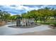 Contemporary playground with diverse play structures and ample space for activities in a park setting at 8253 Ruby Mountain Way, Las Vegas, NV 89128