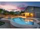 Inviting backyard pool and spa with covered patio, perfect for outdoor entertaining and relaxation at 8253 Ruby Mountain Way, Las Vegas, NV 89128
