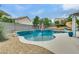 Beautiful in-ground pool and spa surrounded by a spacious patio and desert landscaping at 8253 Ruby Mountain Way, Las Vegas, NV 89128