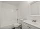Bathroom featuring a vanity, toilet, and tub/shower combo with white tile at 829 Rock Springs Dr # 201, Las Vegas, NV 89128