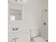 Bathroom featuring a white vanity, toilet, and shower with white tile at 829 Rock Springs Dr # 201, Las Vegas, NV 89128