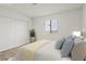 Calm bedroom features a queen bed with soft pillows, a window with blinds, and spacious wardrobe for storage at 829 Rock Springs Dr # 201, Las Vegas, NV 89128