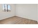 Bedroom featuring wood floors and a window for natural light at 829 Rock Springs Dr # 201, Las Vegas, NV 89128