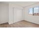 Bedroom features a window for natural light and a closet with sliding doors at 829 Rock Springs Dr # 201, Las Vegas, NV 89128