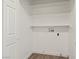 Laundry room featuring built-in shelves and hookups for a washer and dryer at 829 Rock Springs Dr # 201, Las Vegas, NV 89128