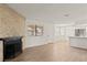 Open living area featuring a decorative fireplace, new flooring and large window providing ample natural light at 829 Rock Springs Dr # 201, Las Vegas, NV 89128