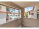 Balcony view of the community pool, surrounded by lush landscaping and palm trees providing a relaxing atmosphere at 829 Rock Springs Dr # 201, Las Vegas, NV 89128