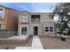 Two-story home with a front patio, balcony, and xeriscaped yard offers stylish curb appeal at 9148 Alluring Ave, Las Vegas, NV 89149
