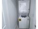 A stacked white washer and dryer appliance with energy guide stickers in a utility area at 9148 Alluring Ave, Las Vegas, NV 89149