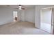 Spacious main bedroom with carpet, bright lighting, and access to balcony at 9148 Alluring Ave, Las Vegas, NV 89149