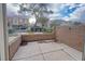 A small, brick walled patio with concrete flooring with a wrought iron fence at 9148 Alluring Ave, Las Vegas, NV 89149