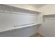 Walk-in closet with neutral carpet, shelving, and metal bars for hanging clothing at 9148 Alluring Ave, Las Vegas, NV 89149