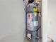 Close up of the Rheem brand water heater with safety warnings in the garage at 9148 Alluring Ave, Las Vegas, NV 89149