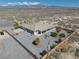 Well-maintained backyard with desert landscaping, desert surroundings, covered patio, and mountain views at 961 Laguna St, Pahrump, NV 89048