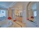 Elegant bathroom with double sinks, a large soaking tub and natural light at 961 Laguna St, Pahrump, NV 89048