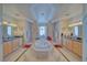 Bright bathroom with double sinks, a large soaking tub and decorative mirrors at 961 Laguna St, Pahrump, NV 89048
