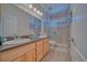Bathroom featuring double sinks, and tiled walk-in shower with glass door at 961 Laguna St, Pahrump, NV 89048