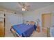Cozy bedroom with ceiling fan, neutral paint, and large closet at 961 Laguna St, Pahrump, NV 89048