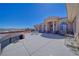 Exterior of charming home featuring a large outdoor patio and decorative pillars that accent the front entryway at 961 Laguna St, Pahrump, NV 89048