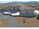 Inviting single-story home showcasing desert landscaping and a covered patio for outdoor relaxation at 961 Laguna St, Pahrump, NV 89048