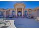 Elegant exterior showcasing architectural details, a covered entryway, and well-maintained landscaping for enhanced curb appeal at 961 Laguna St, Pahrump, NV 89048