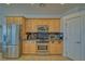 Bright kitchen featuring stainless steel appliances, wood cabinets, granite countertops, and recessed lighting at 961 Laguna St, Pahrump, NV 89048