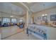 Spacious living room featuring tile flooring, recessed lighting, and comfortable leather seating at 961 Laguna St, Pahrump, NV 89048