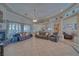 Spacious living room with fireplace, tile flooring, and comfortable leather furniture at 961 Laguna St, Pahrump, NV 89048