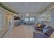 Inviting living room features tile floors, a fireplace, comfortable seating and plenty of natural light at 961 Laguna St, Pahrump, NV 89048