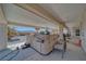 Covered patio area with a relaxing hot tub, offering a private outdoor spa experience with views of the backyard at 961 Laguna St, Pahrump, NV 89048