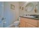 Bright powder room with granite countertop vanity and framed mirror at 961 Laguna St, Pahrump, NV 89048