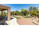 Lush backyard featuring manicured landscaping, rock features and inviting swing set perfect for relaxation and outdoor enjoyment at , Henderson, NV 89044