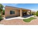 Backyard showcasing a covered patio and landscaped yard, ideal for outdoor relaxation and entertaining guests at , Henderson, NV 89044