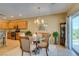 Charming dining area with modern light fixture and easy access to the kitchen at , Henderson, NV 89044