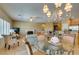 Open dining and living room space, featuring tile flooring and modern light fixtures at , Henderson, NV 89044