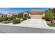 Charming single-story home featuring a well-maintained front yard and a two-car garage at , Henderson, NV 89044