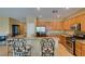 Open kitchen with granite counters, a breakfast bar with chairs and stainless steel appliances at , Henderson, NV 89044