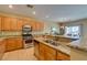 Spacious kitchen with stainless steel appliances, granite countertops, and a large breakfast bar at , Henderson, NV 89044