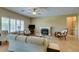 Bright living room with tile floors, neutral decor, and a cozy fireplace as a focal point at , Henderson, NV 89044