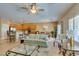 Well-lit living space with kitchen access, tile flooring, and a comfortable seating area at , Henderson, NV 89044