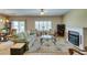 Spacious living area featuring tile floors, a fireplace, and access to the outdoor patio at , Henderson, NV 89044