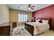 Bedroom features a ceiling fan, shuttered window, and a decorative rug under the bed at , Henderson, NV 89044